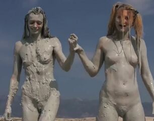Women naked in dirt